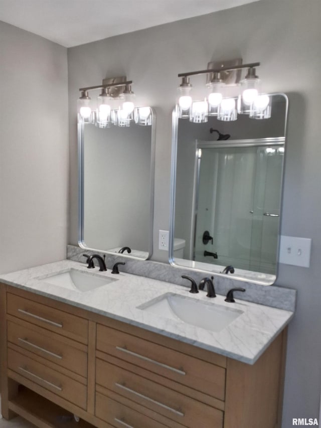 309 W 11th St, Metropolis, IL 62960 - full bathroom featuring a shower with shower door, a notable chandelier, double vanity, and a sink