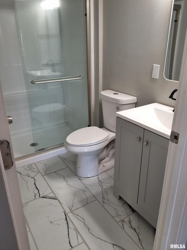 309 W 11th St, Metropolis, IL 62960 - bathroom with marble finish floor, toilet, a stall shower, and vanity