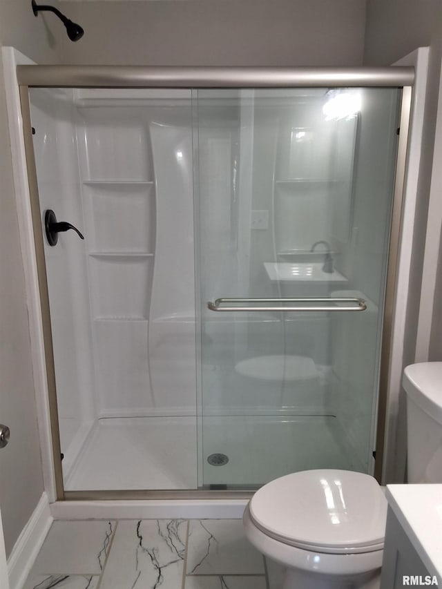 309 W 11th St, Metropolis, IL 62960 - bathroom featuring marble finish floor, toilet, vanity, and a shower stall