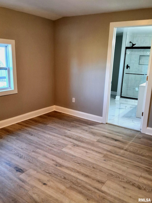 309 W 11th St, Metropolis, IL 62960 - spare room featuring baseboards and wood finished floors