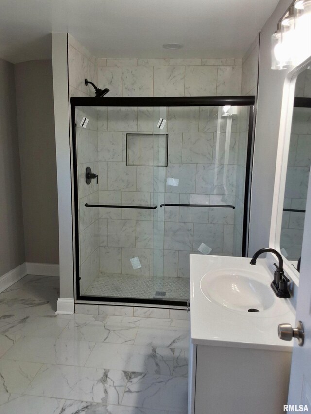 309 W 11th St, Metropolis, IL 62960 - bathroom featuring baseboards, marble finish floor, a stall shower, and vanity