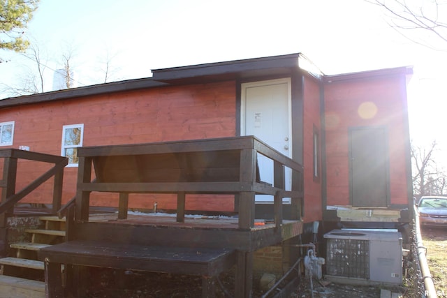 back of house featuring cooling unit