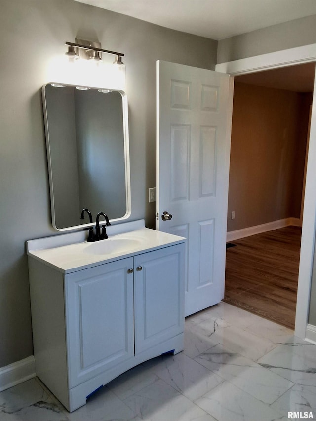 309 W 11th St, Metropolis, IL 62960 - bathroom with marble finish floor, vanity, and baseboards