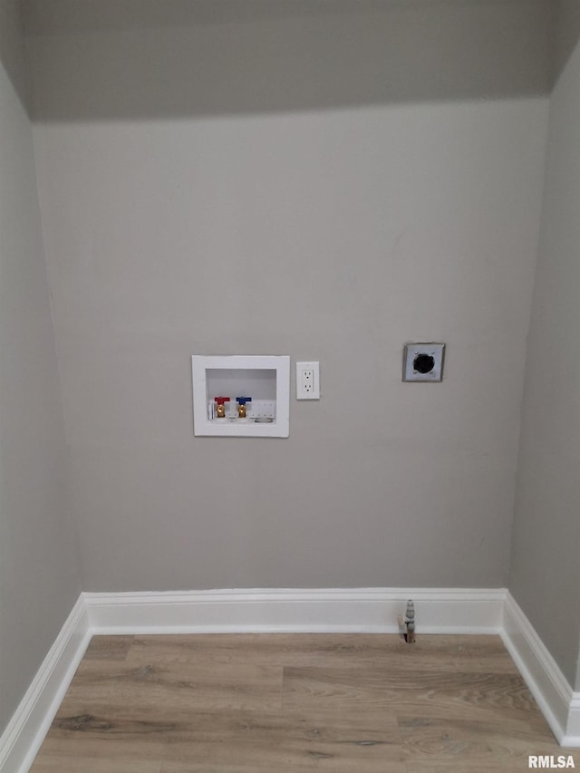 309 W 11th St, Metropolis, IL 62960 - clothes washing area with hookup for a washing machine, wood finished floors, baseboards, and electric dryer hookup
