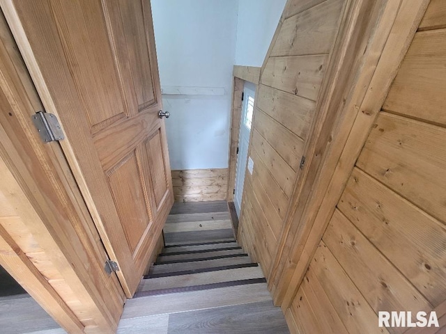 stairway with hardwood / wood-style flooring