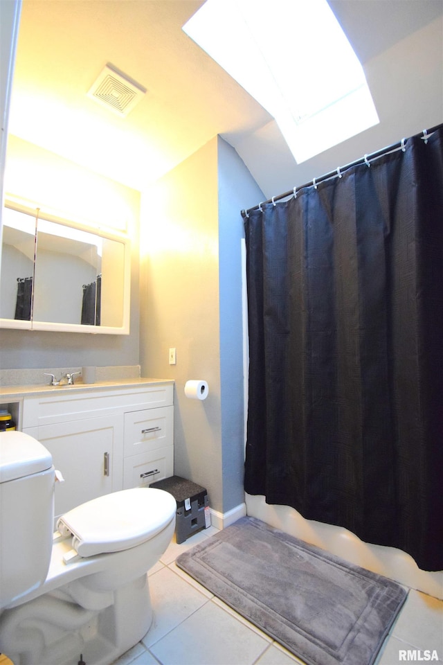 bathroom with tile patterned floors, vanity, and toilet