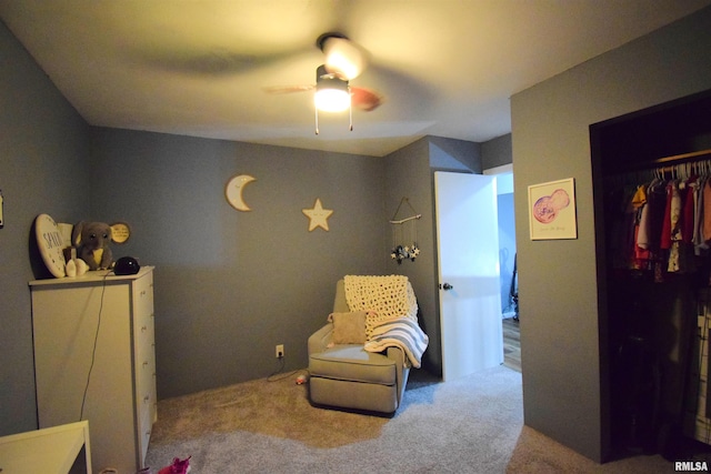 interior space featuring ceiling fan and carpet