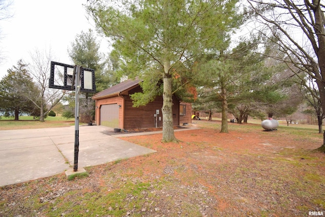 exterior space featuring an outbuilding and a garage