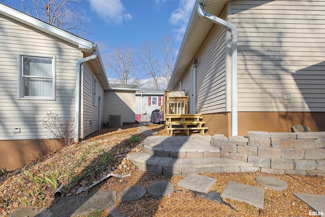 view of property exterior with central AC unit