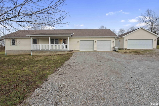 single story home with a porch and a garage