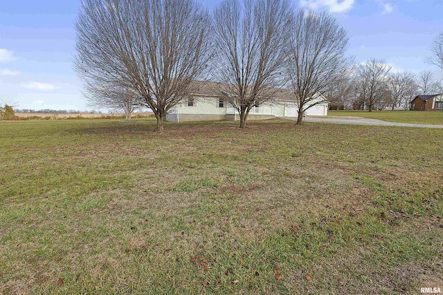 view of yard with a garage