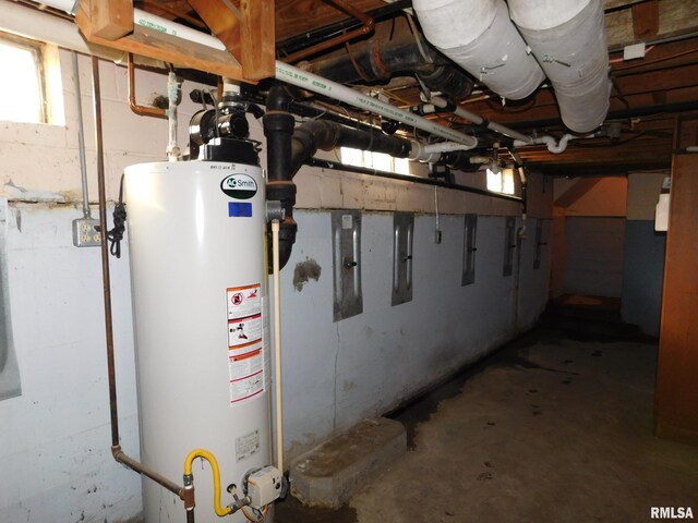 utility room featuring gas water heater