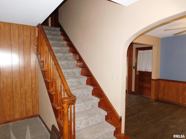 stairway with wooden walls