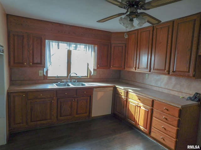 kitchen with white dishwasher, ceiling fan, dark hardwood / wood-style flooring, and sink