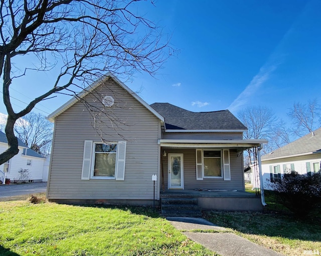 bungalow featuring a porch and a front yard