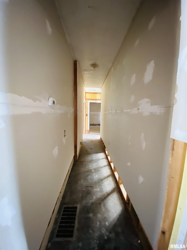 corridor with concrete flooring