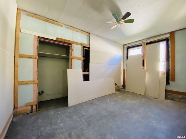 unfurnished bedroom featuring a closet and ceiling fan