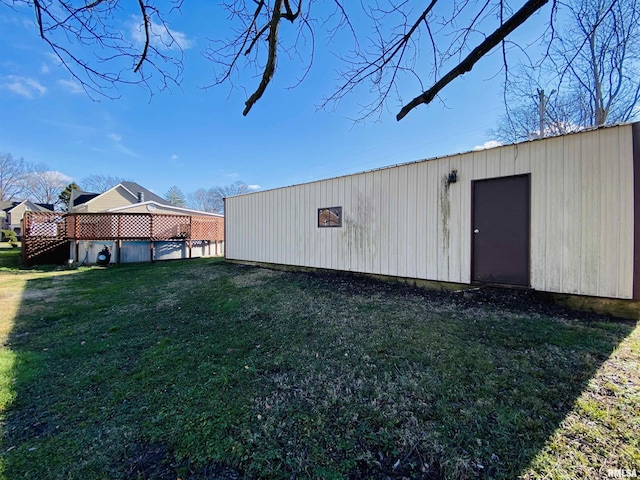 view of outdoor structure with a yard