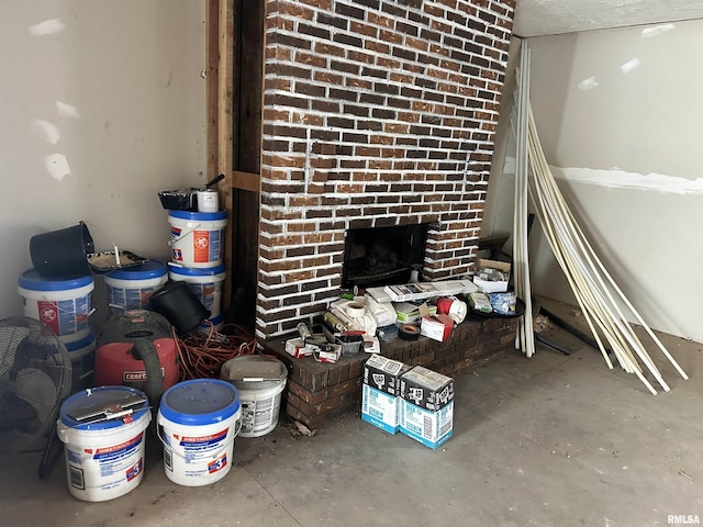 room details featuring a fireplace and concrete floors