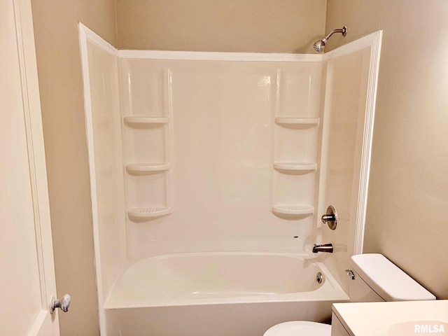 full bathroom with toilet, vanity, and washtub / shower combination