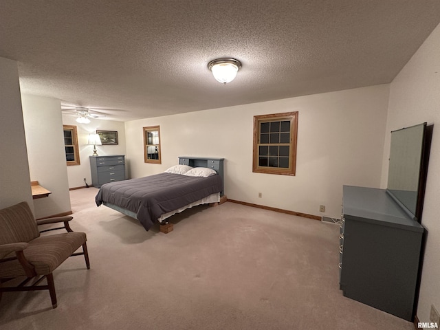 10965 E 700th Ave, Watson, IL 62473 - bedroom with light carpet, a textured ceiling, baseboards, and ceiling fan