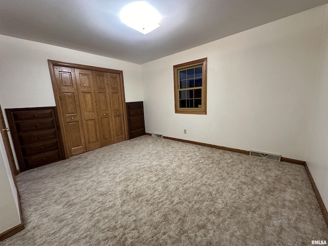 10965 E 700th Ave, Watson, IL 62473 - unfurnished bedroom featuring carpet, a closet, and baseboards