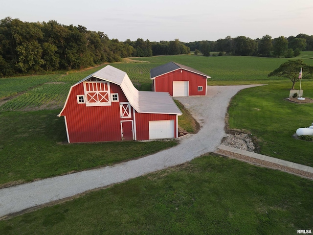 view of outdoor structure with a yard and a rural view