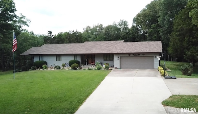 ranch-style home featuring a garage and a front yard