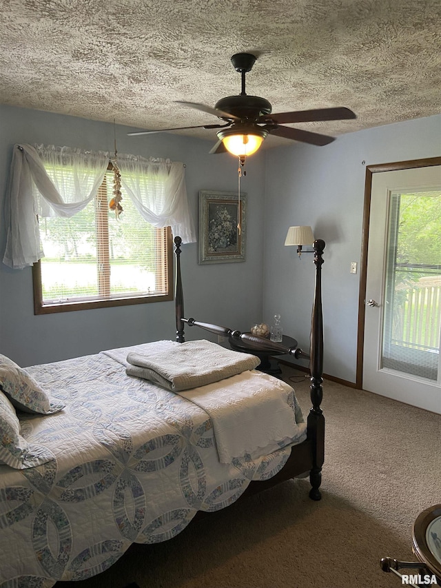 carpeted bedroom with ceiling fan, access to outside, and multiple windows