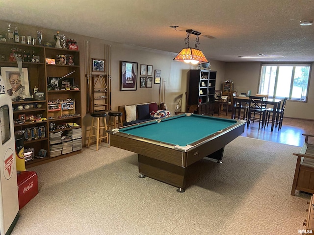 rec room featuring carpet flooring, a textured ceiling, and pool table