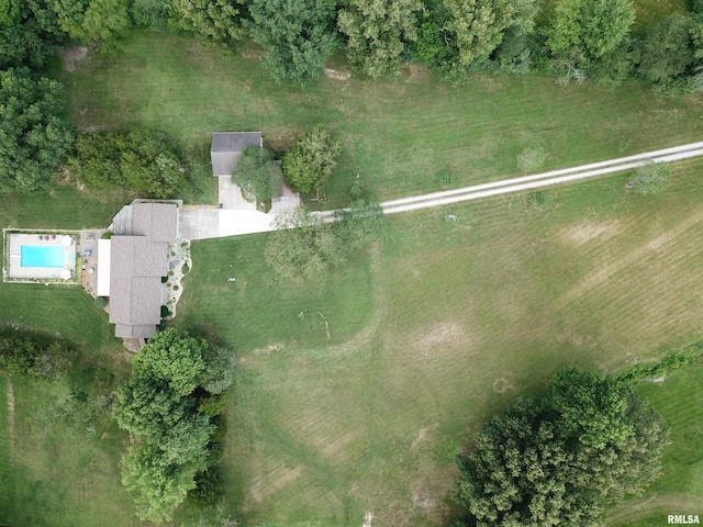 birds eye view of property with a rural view