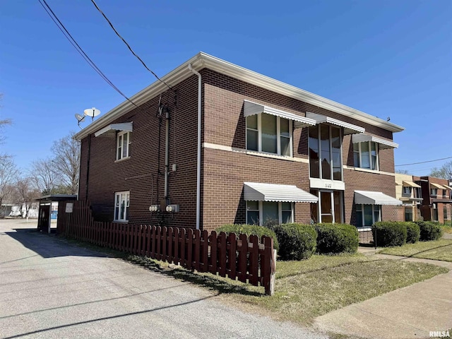 1408 Manning St, Murphysboro, IL 62966 - view of property exterior featuring brick siding and fence