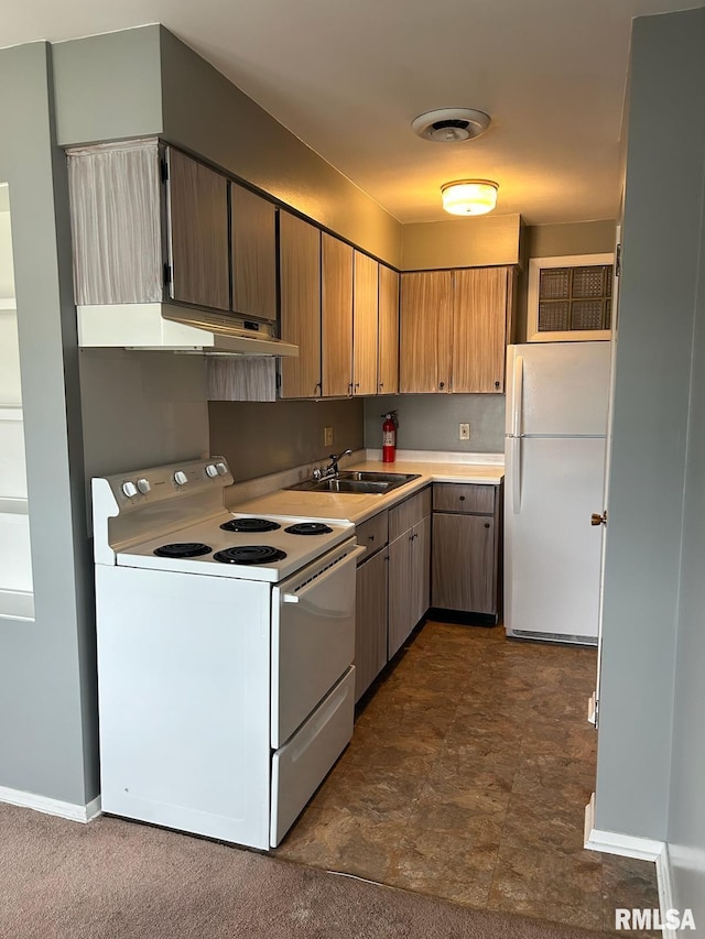 kitchen featuring white appliances and sink