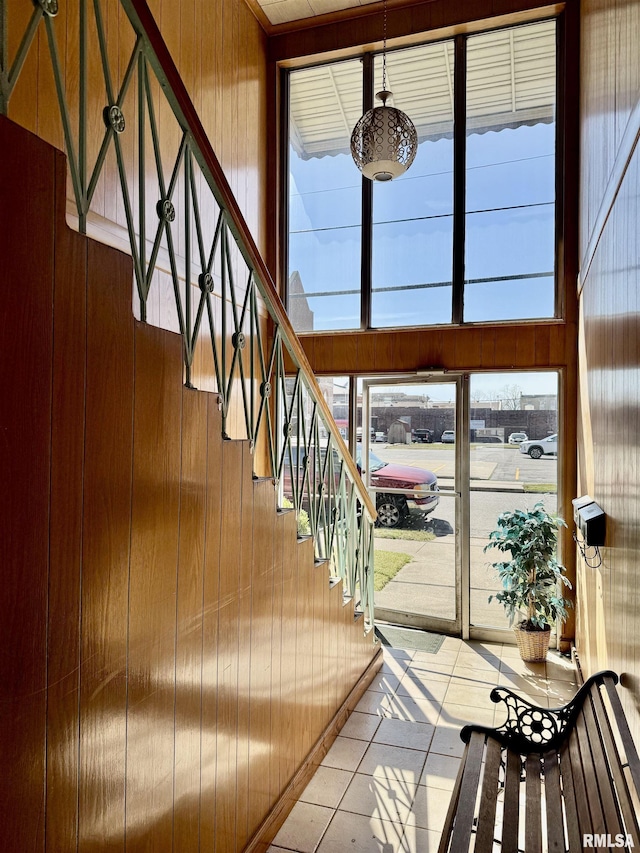 1408 Manning St, Murphysboro, IL 62966 - tiled foyer entrance with stairs, wooden walls, and a wealth of natural light