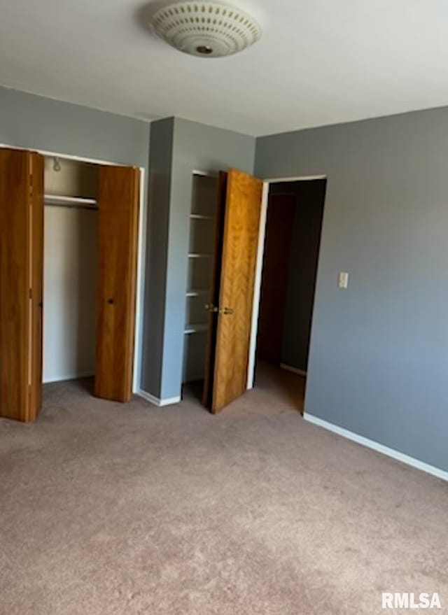 1408 Manning St, Murphysboro, IL 62966 - unfurnished bedroom with carpet, visible vents, a closet, and baseboards