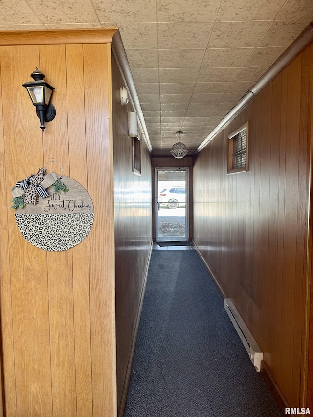 1408 Manning St, Murphysboro, IL 62966 - hallway featuring baseboard heating, wood walls, and carpet flooring