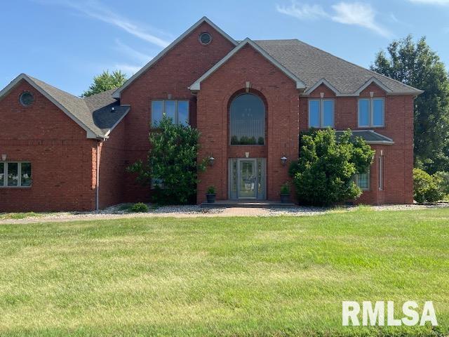 front facade with a front lawn