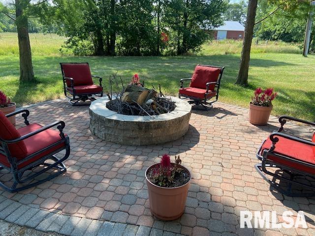 view of patio featuring a fire pit