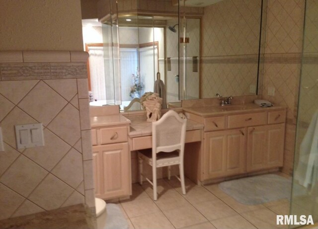 bathroom with tile patterned floors and vanity