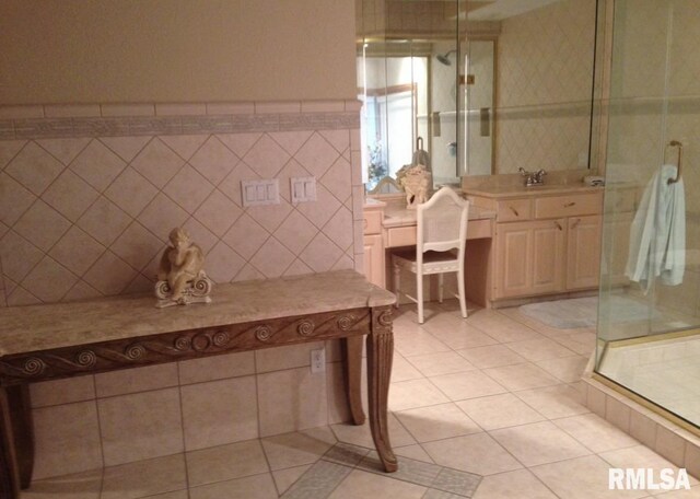 bathroom with tile patterned flooring and vanity