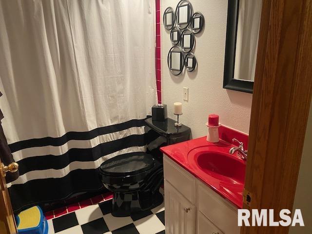 bathroom with vanity and toilet