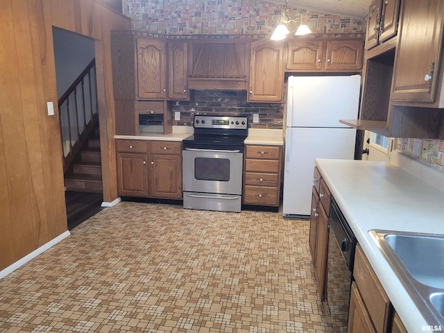 kitchen with exhaust hood, white refrigerator, electric range, black dishwasher, and decorative light fixtures