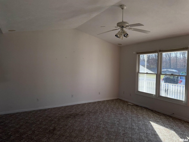 spare room featuring carpet floors, ceiling fan, and lofted ceiling