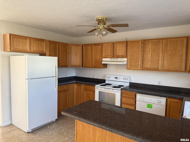 kitchen with a textured ceiling, white appliances, and ceiling fan