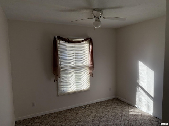 spare room with ceiling fan and carpet floors