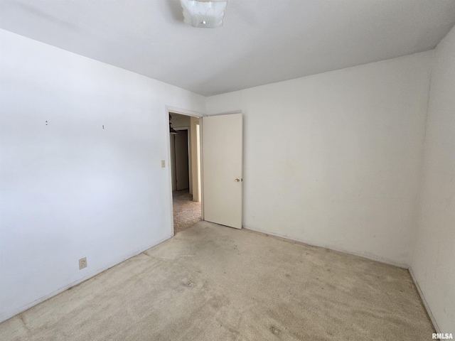 spare room with light colored carpet