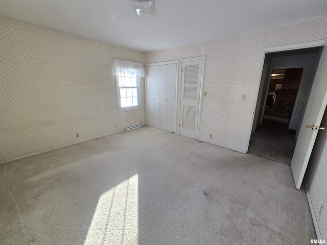 unfurnished bedroom with light carpet