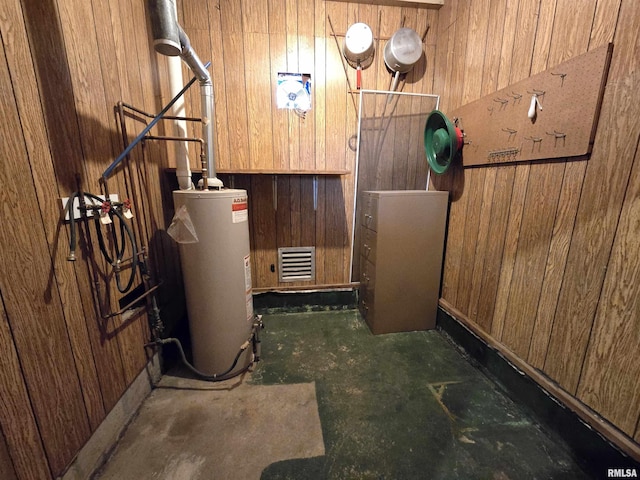 utility room featuring water heater