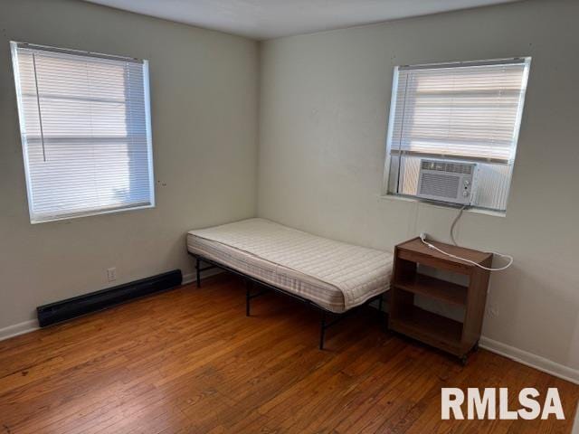 interior space featuring cooling unit and dark hardwood / wood-style floors