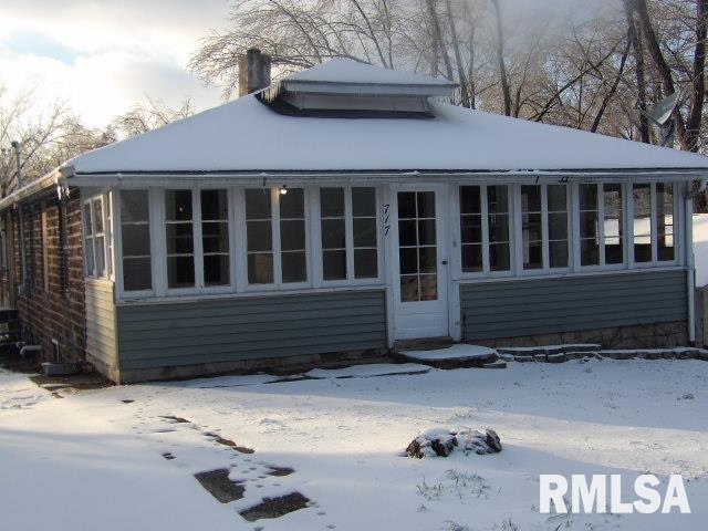 view of snow covered house